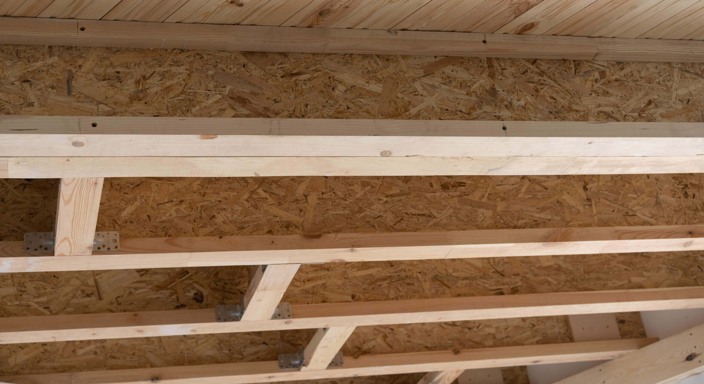 The interior roof of a quality, wooden shed.