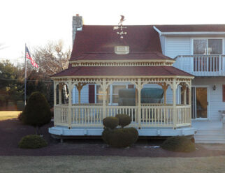 10 x 20 Oval Gazebo, New England style Shown with cupola and copper eagle weathervane, Pagoda roof and asphalt shingles. (built without floor onto existing deck)