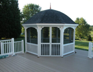 14 Foot White Vinyl Gazebo With Black Shingled Bell Roof On A Deck