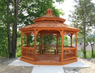 14’ Octagon Gazebo, Colonial style. Shown with cedar stain, 7 bench sections, Pagoda roof, cupola and cedar shake shingles