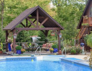 14’ x 16’ Alpine Cedar Wood Pavilion With Custom Stain, Asphalt Shingles In A Backyard Pool Patio Setting