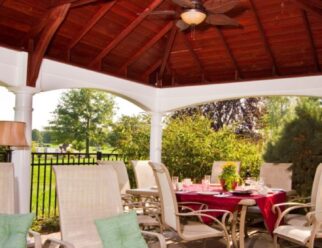 Interior View Of Hamption Pavilion With Lounge Chairs, Table With Dining Chairs