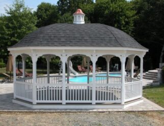 14x20 White Vinyl Gazebo With Bell Style Roof, Copper Cupola and Black Shingles in front of a pool