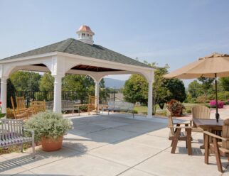 14’ x 20’ Traditional White Vinyl Pavilion With 10 inch Round Posts and Asphalt Shingles In Backyard