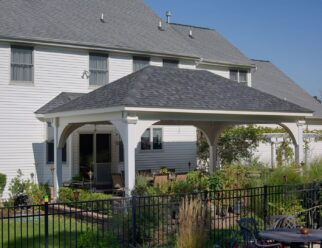 14’ x 22’ Grand Estate White Vinyl Pavilion With Asphalt Shingles In Backyard