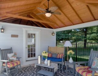 Interior View Of Backyard Pavilion With Outdoor Patio Furniture, Ceiling Fan, and Area Rug