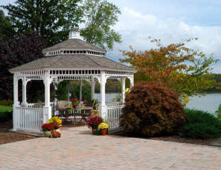 16′ Octagon, Country Style, White Vinyl Gazebo With Pagoda Roof Next To A Lake