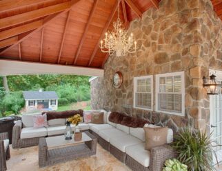 Interior View Of Hampton Pavilion With Outdoor Chandelier Attached To Stone Pool House