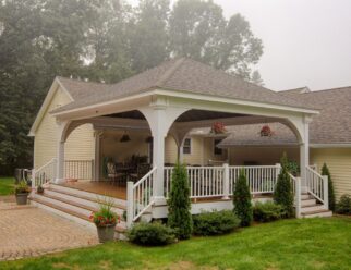 22’ x 24’ Grand Estate White Vinyl Pavilion Shown With Asphalt Shingles On A Backyard Deck