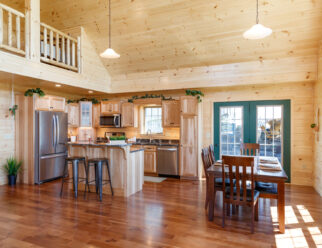 Kitchen with Quartz Counter Tops and Hickory Flat-Panel Tiered Island in the 28×52 Mountaineer Deluxe Cabin