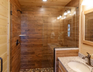 Mountaineer Deluxe Cabin Interior - Bathroom with Tile Shower and Frameless Glass Door