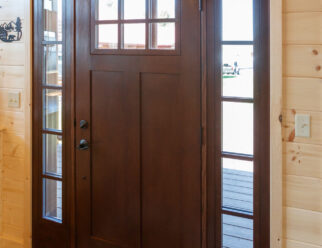 28×52 Mountaineer Deluxe Cabin Interior - Front Door with 6-lite Signet Fir Entry Door with Stained Sidelites