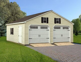 Double Wide Garage With Tan Vinyl Siding And White Garage door