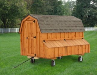Stained wood Dutch-styled 4'x8' Amish Chicken Coop with brown shingles, feeding box, and wheels