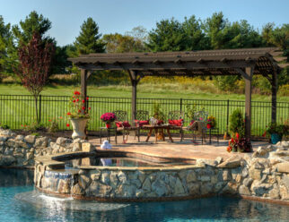 12’ x 17’ Wooden Hearthside Style Amish Pergola With Cinder Stain, Lattice Roof In Backyard Pool Deck