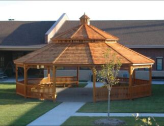 30′ Dodecagon Wooden Gazebo Shown with Dutch Style, Cupola, Pagoda Roof, Cedar Stain, Benches, Cedar Shake Shingles
