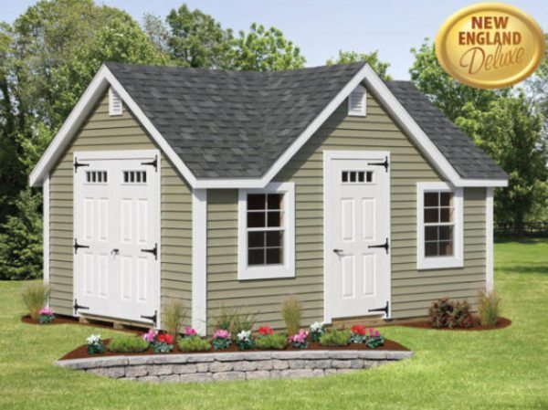 Beige vinyl shed with windows and doorways in backyard