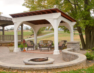 White Vinyl 10 x 14 Santa Fe Pavilion With Natural Wood Beamed Roof In A Backyard Patio