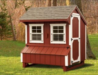 Red wood Amish-built 5'x6' Chicken Coop with overhang roof with black shingles, two windows, and white trim accents