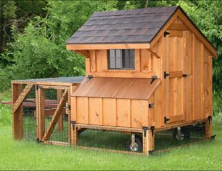 Stained wood 4'x4' Amish Chicken Coop with shingled overhead roof, window, wheels, and built in cage.