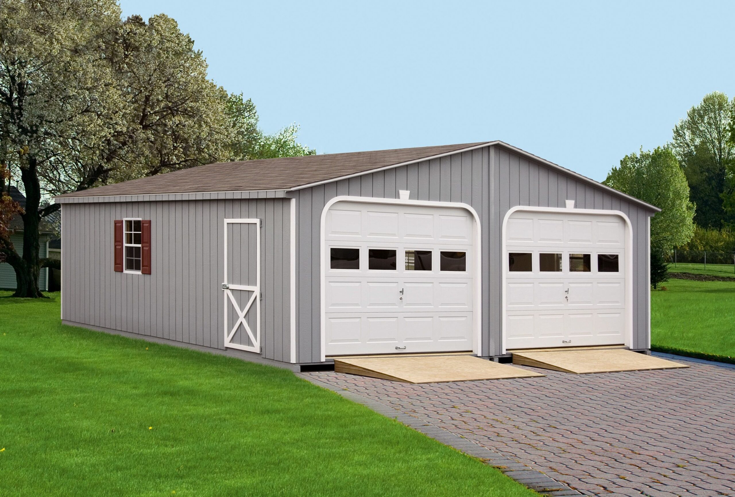 Grey Wooden Double Wide Garage With White Garage Doors