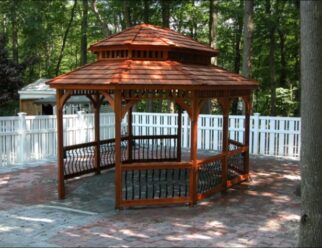 12’ x 16’ Wood Oval Gazebo Shown in Baroque Style, Pagoda Roof, No Floor, Cedar Stain, Cedar Shake