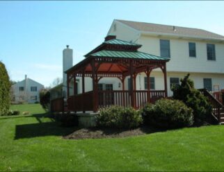 10’ x 16’ Wood Rectangle Gazebo Shown in Dutch Style, Cupola, Pagoda Roof, No Floor, Custom Stain, Standard Ribbed Metal Roofing