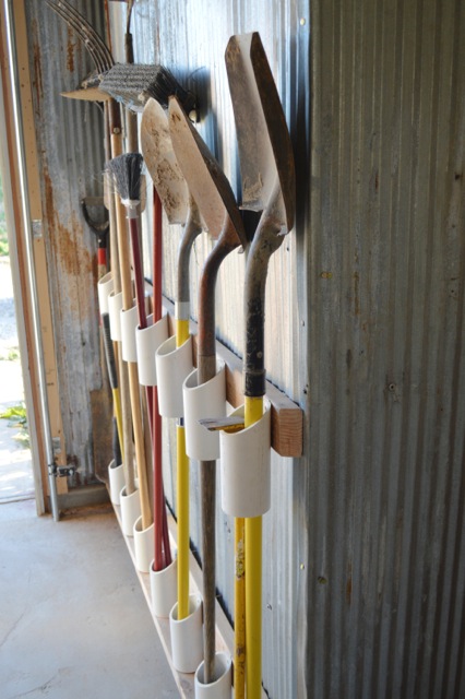 organize your shed with slots for large tools