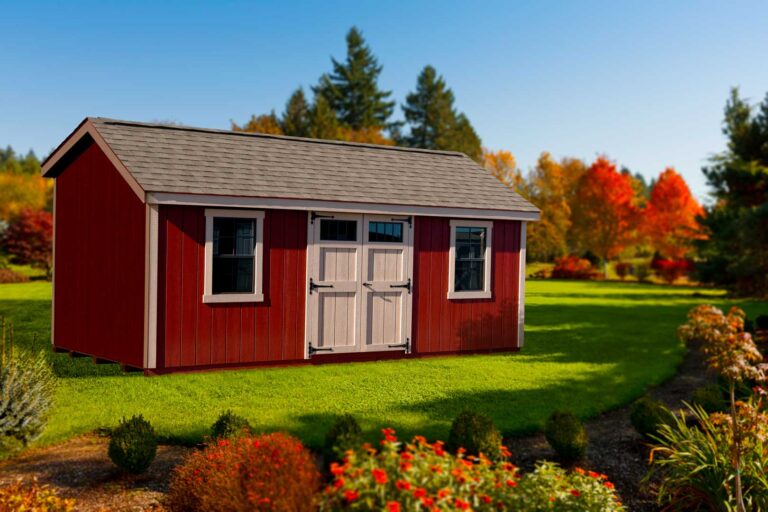 Red Wooden Monterey Barn Shed With White Door And Two Windows With White Trim Around Them In A Backyard