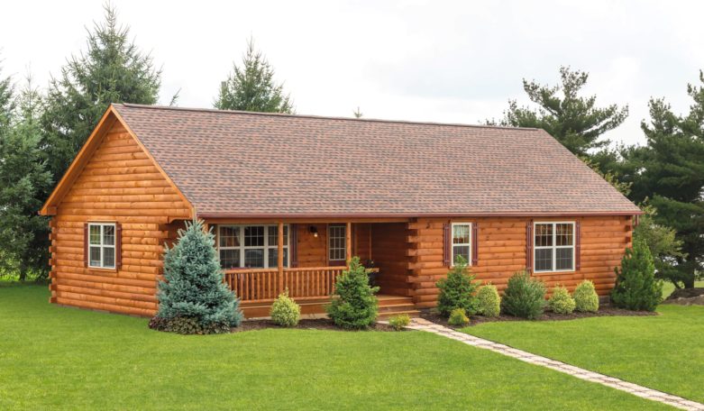 Trees and shrubs are placed around a log home to provide shade.