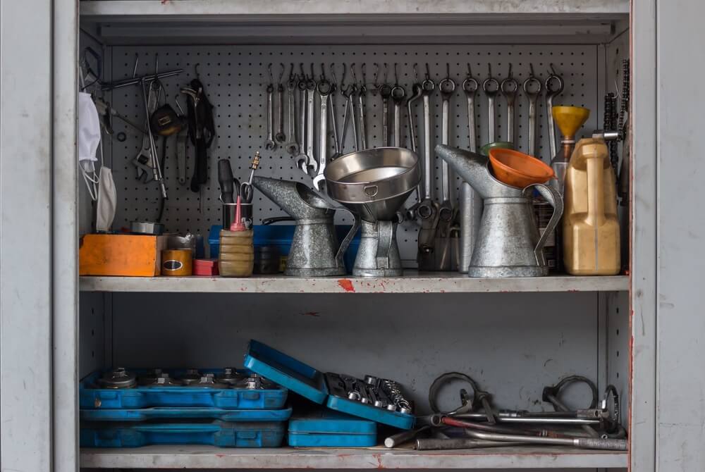 Tool cabinet full of used tools.