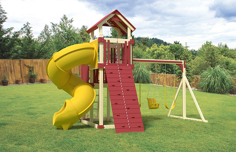 A photograph of a red and yellow vinyl swing set in a backyard.