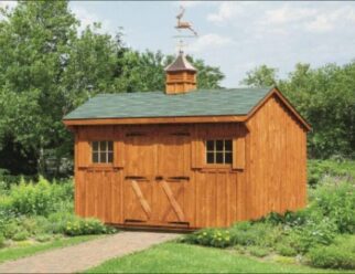 Wood Board and Batten Shed With Green Roof and Copper Weathervane On Top