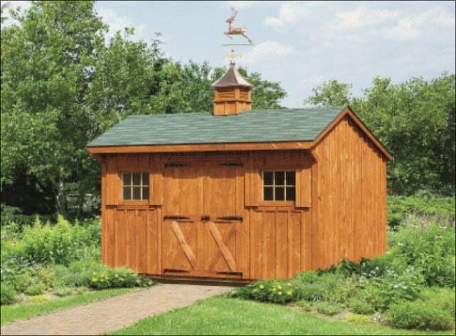 Wood Board and Batten Shed With Green Roof and Copper Weathervane On Top