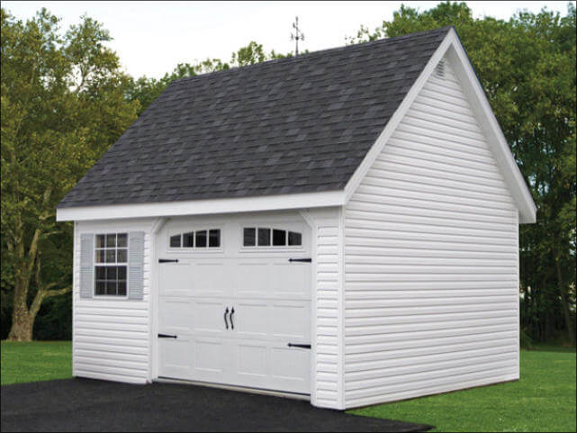 White Vinyl Chalet Shed With A High Pitched Black Shingle Roof With Windows With Gray Shutters