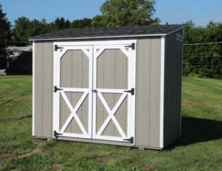 Wooden Gray Mini Barn Shed With White Trim Door