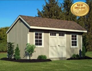 Beige Wooden Quaker Shed With White Door And Two Windows With White Trim With A Brown Shingle Roof