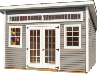 Light gray vinyl studio shed with white doors and windows