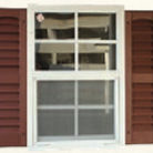 Window with brown exterior shutters