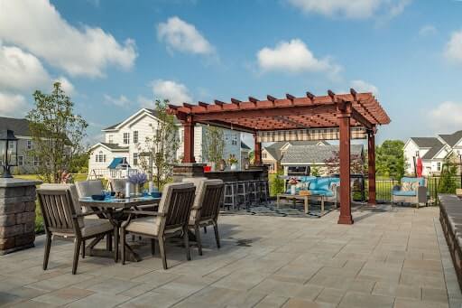 Custom wood pergola over outdoor kitchen.