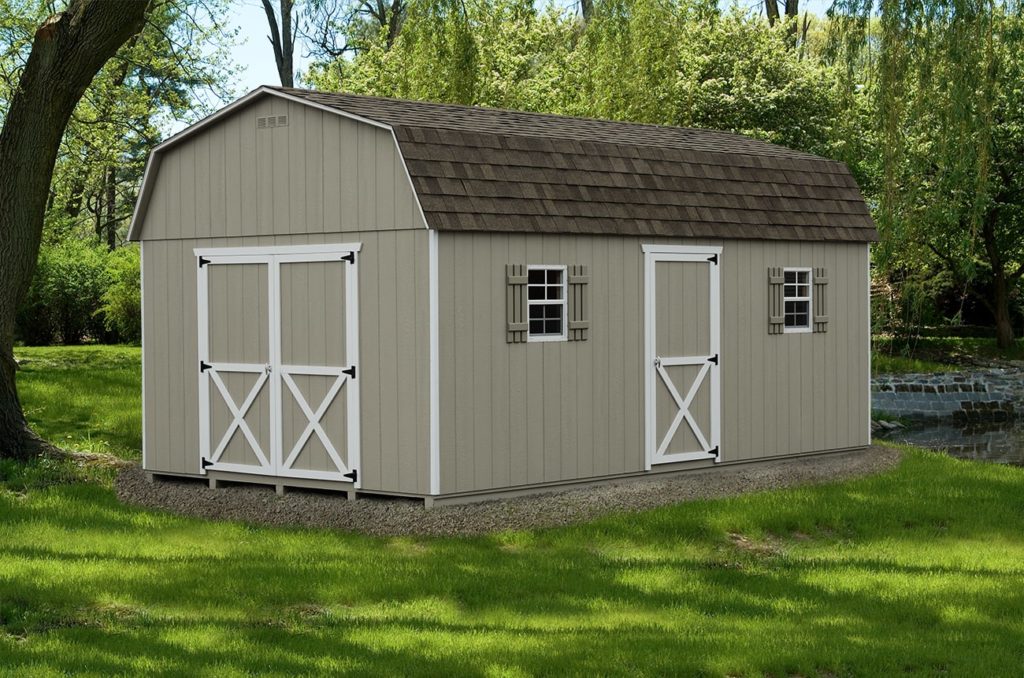 A large tan detached garage that's sitting on a lifted shed foundation.