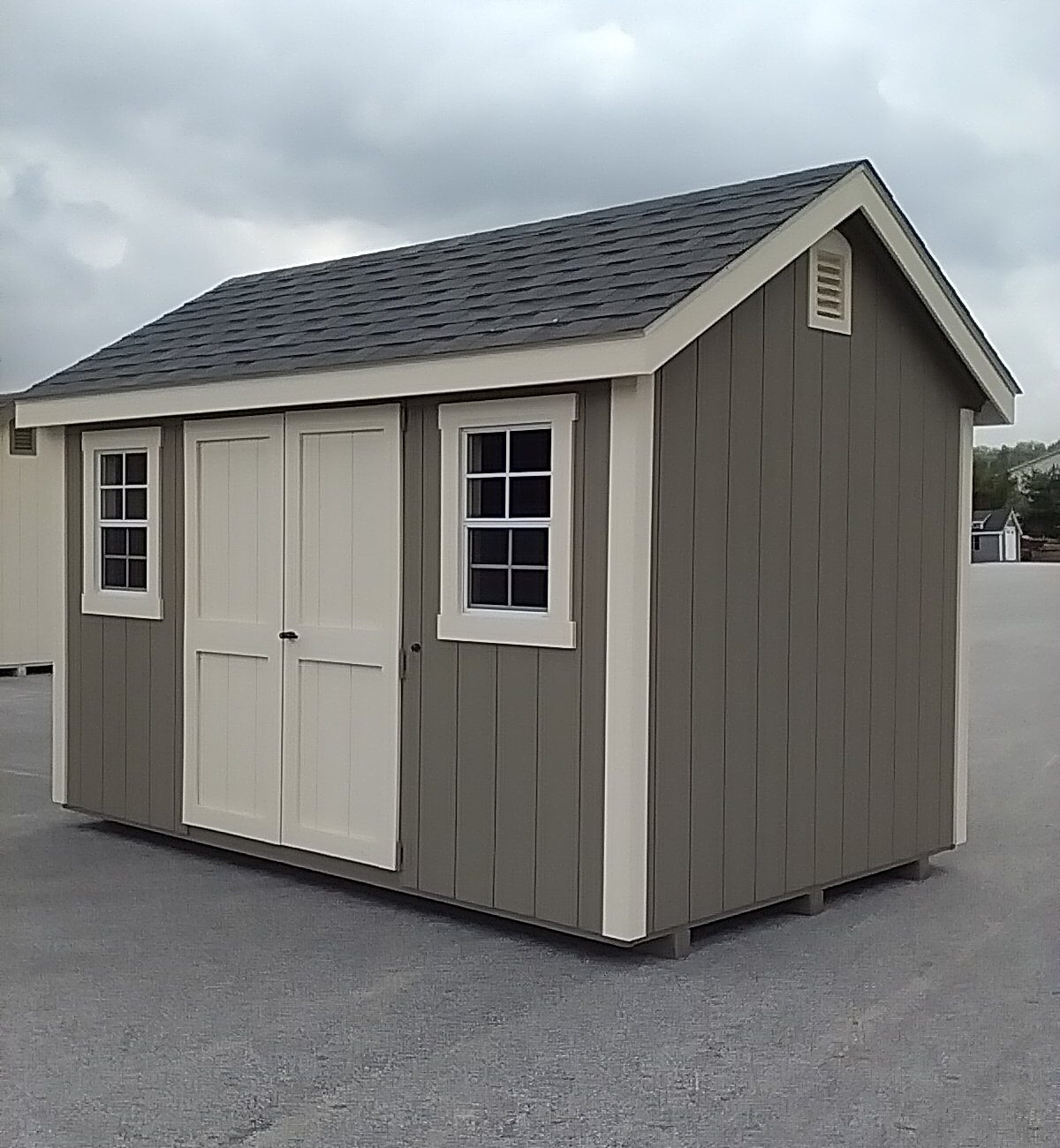 Gray and white New England Cape shed