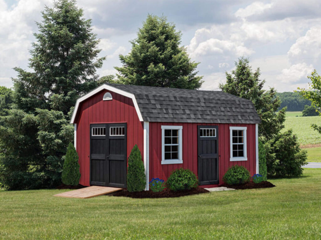 Red Dutch barn shed with a ramp