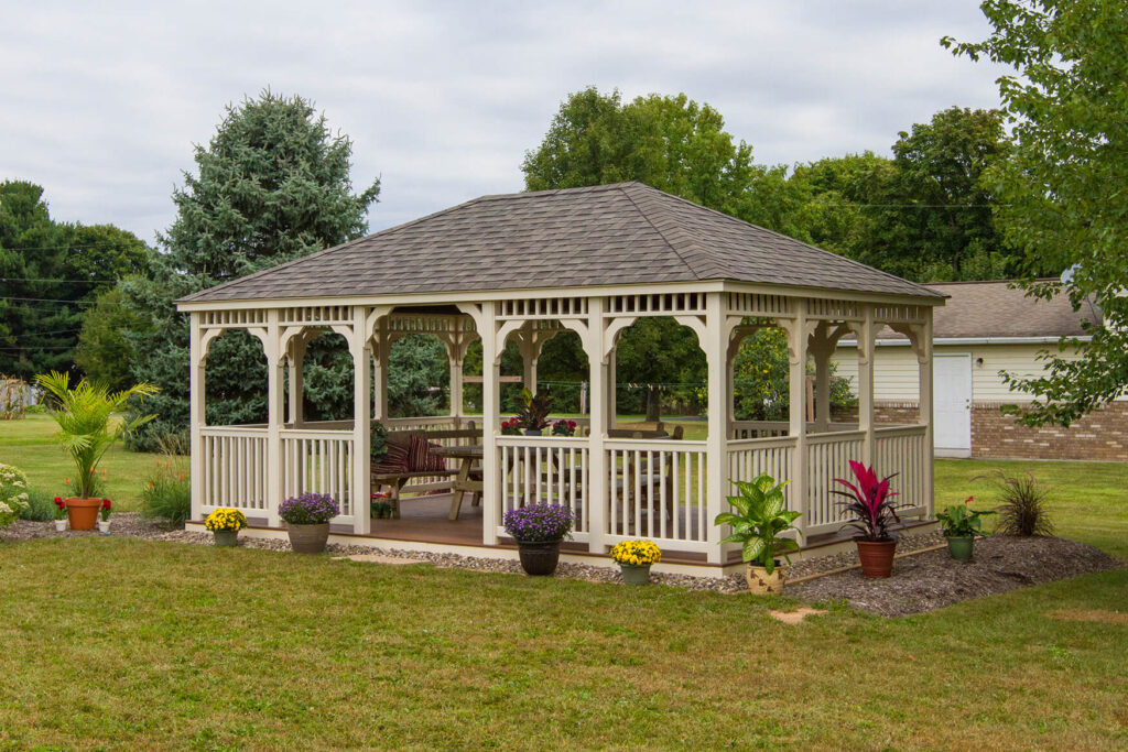 White rectangular gazebo with outdoor seating inside
