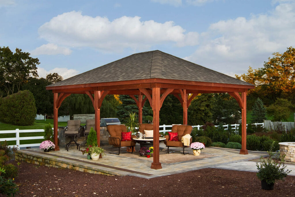 Traditional wooden pavilion providing a patio roof with outdoor seating beneath