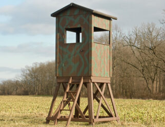 5’x5’ square Amish built deer blind with a 5' tower, ladder, and open windows.