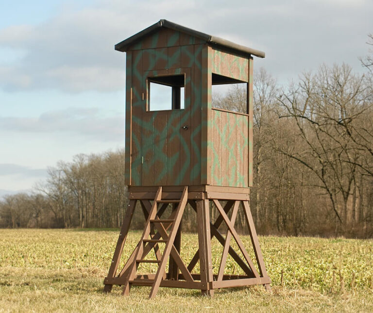 5’x5’ square Amish built deer blind with a 5' tower, ladder, and open windows.