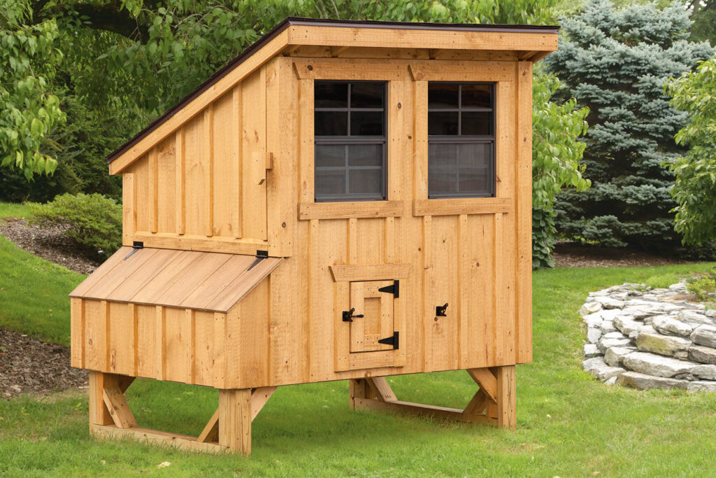 Wooden lean-to style chicken coop for sale in a backyard