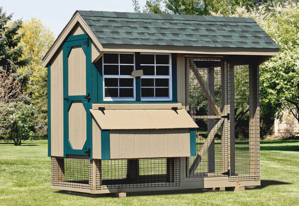 Brown and blue chicken coop for sale in a yard