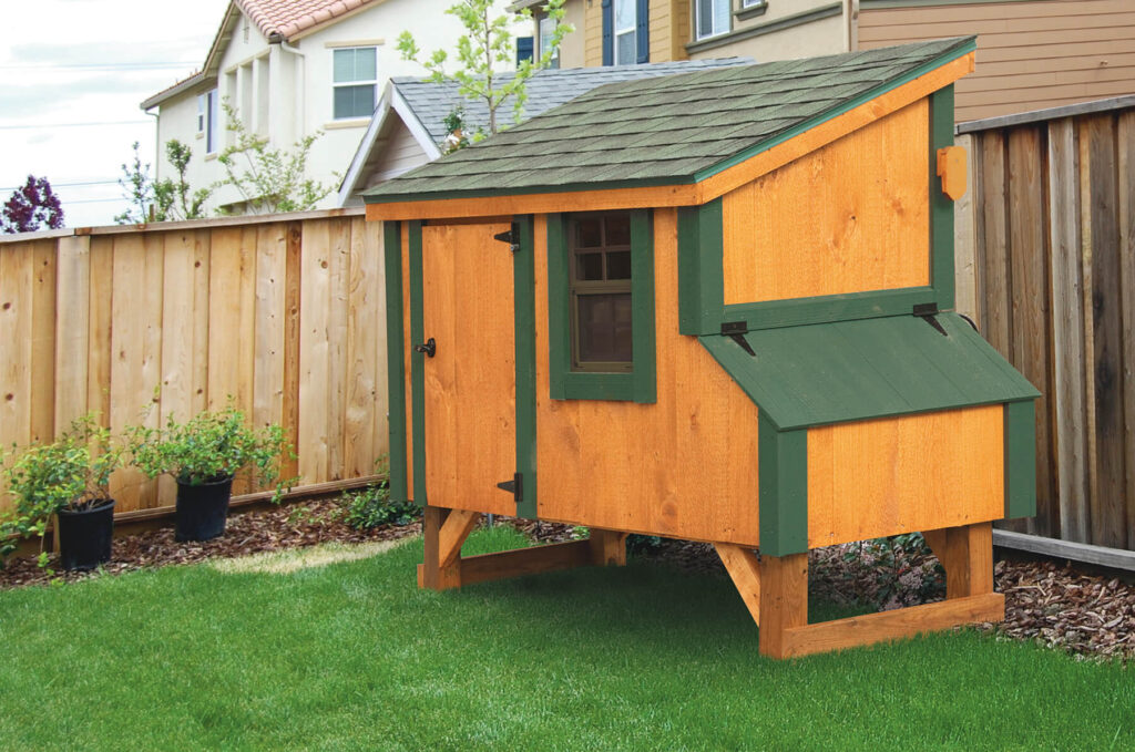 Brown and green Lean-To chicken coop for sale in a backyard